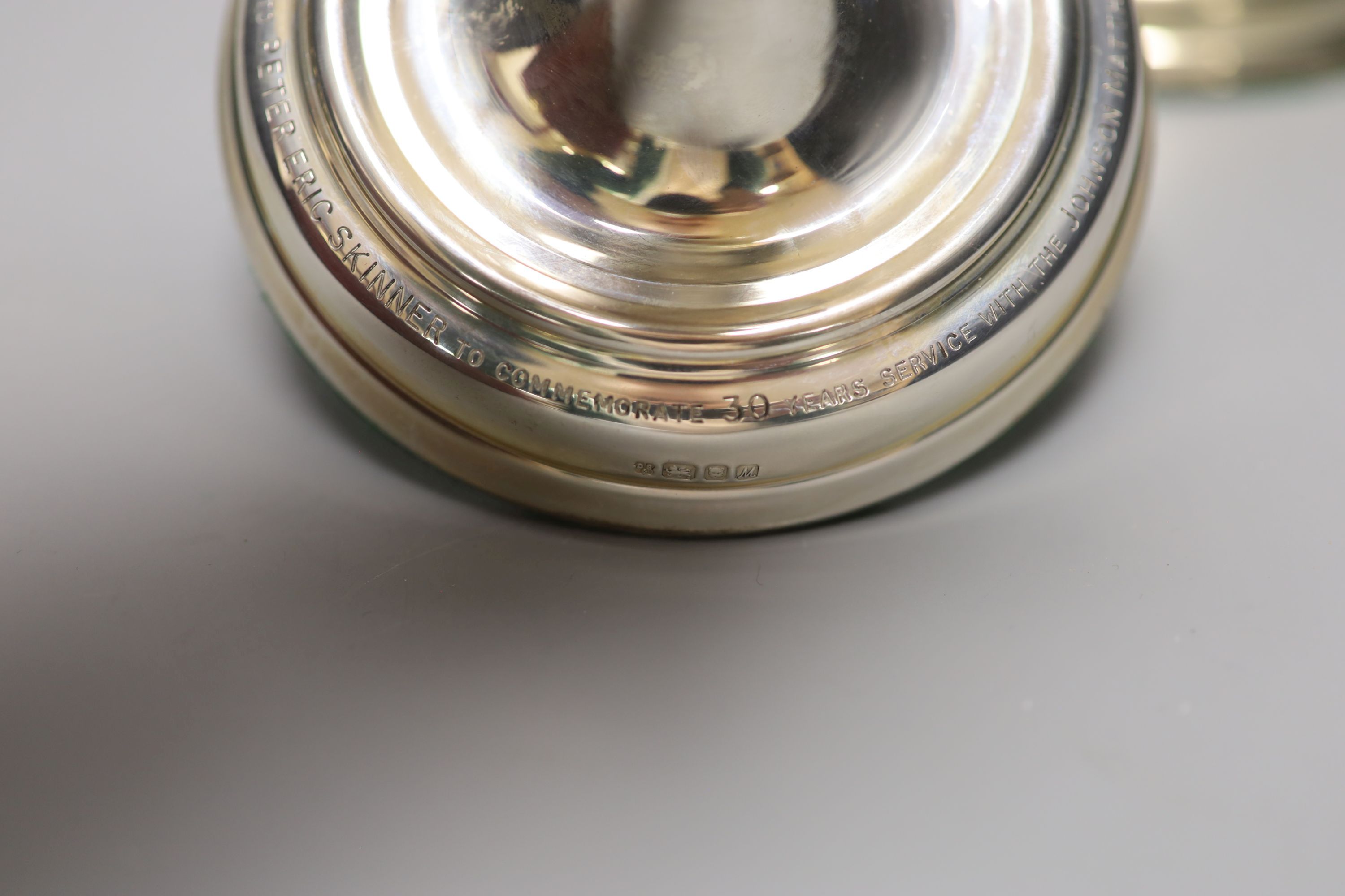 A pair of George II style silver presentation candlesticks, weighted, London 1986, David Shaw Silverware Ltd, in fitted case
